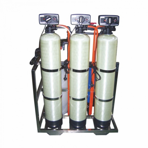 Multi-stage commercial/industrial water softener with carbon and resin